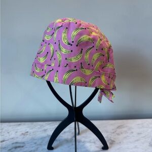 Pink scrub cap with bananas